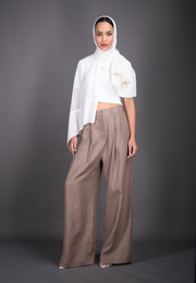 Model wearing 3-in-1 cotton top, linen pants, and silk scarf, front view – East Vibe